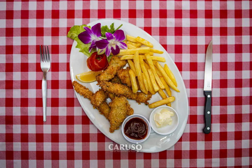 Breaded chicken with French fries